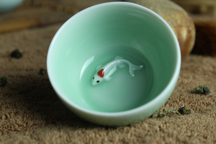 Porcelain tea cup fish relief cup of tea Chinese tea cup ceramic cups creative