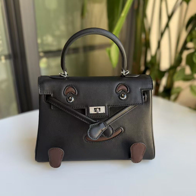 2026 new first-layer cowhide spoof smiley face small bag graffiti Kelly bag panda bag genuine leather portable messenger bag