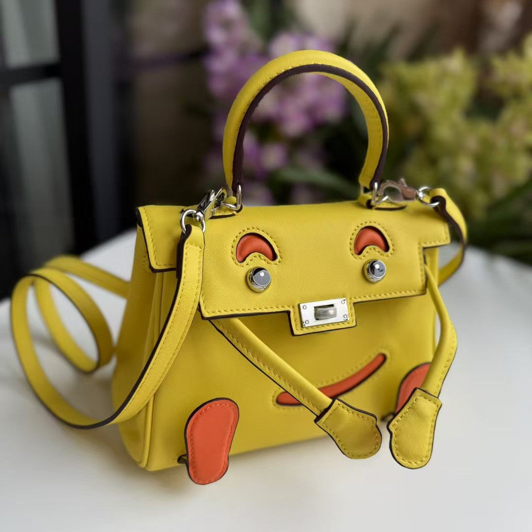 2026 new first-layer cowhide spoof smiley face small bag graffiti Kelly bag panda bag genuine leather portable messenger bag