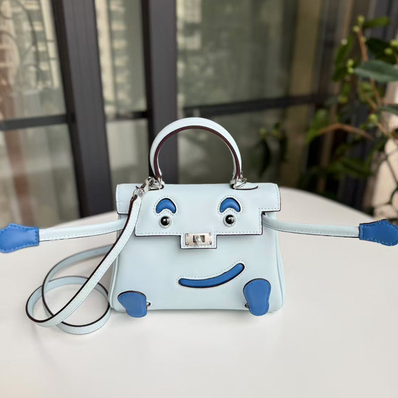 2026 new first-layer cowhide spoof smiley face small bag graffiti Kelly bag panda bag genuine leather portable messenger bag