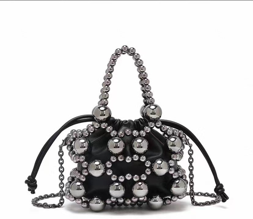 Cross-border new niche design exquisite hollow metal beaded woven bag 2025 new sense portable oblique span bag