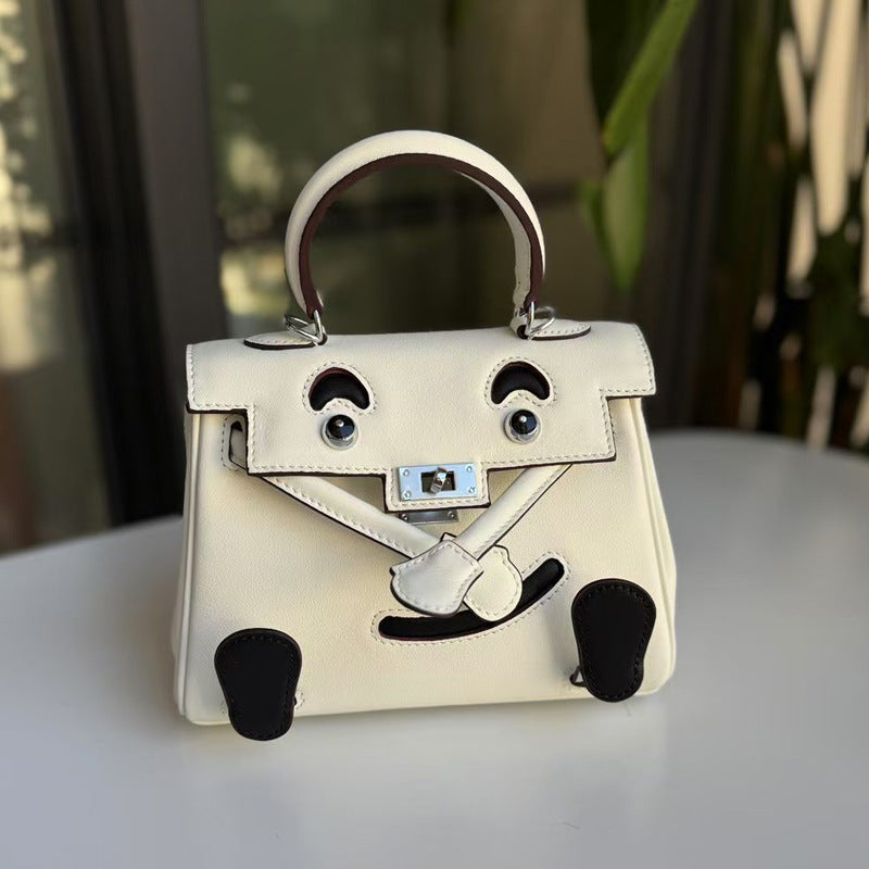 2026 new first-layer cowhide spoof smiley face small bag graffiti Kelly bag panda bag genuine leather portable messenger bag