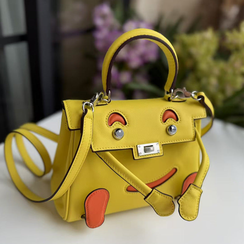 2026 new first-layer cowhide spoof smiley face small bag graffiti Kelly bag panda bag genuine leather portable messenger bag
