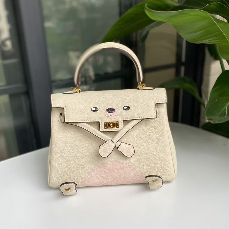 2026 new first-layer cowhide spoof smiley face small bag graffiti Kelly bag panda bag genuine leather portable messenger bag