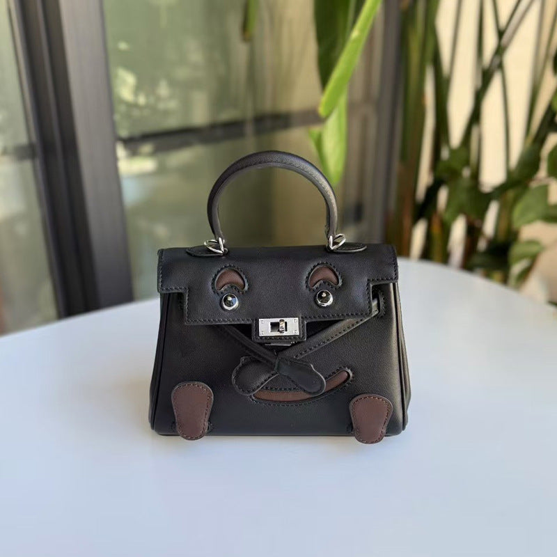 2026 new first-layer cowhide spoof smiley face small bag graffiti Kelly bag panda bag genuine leather portable messenger bag