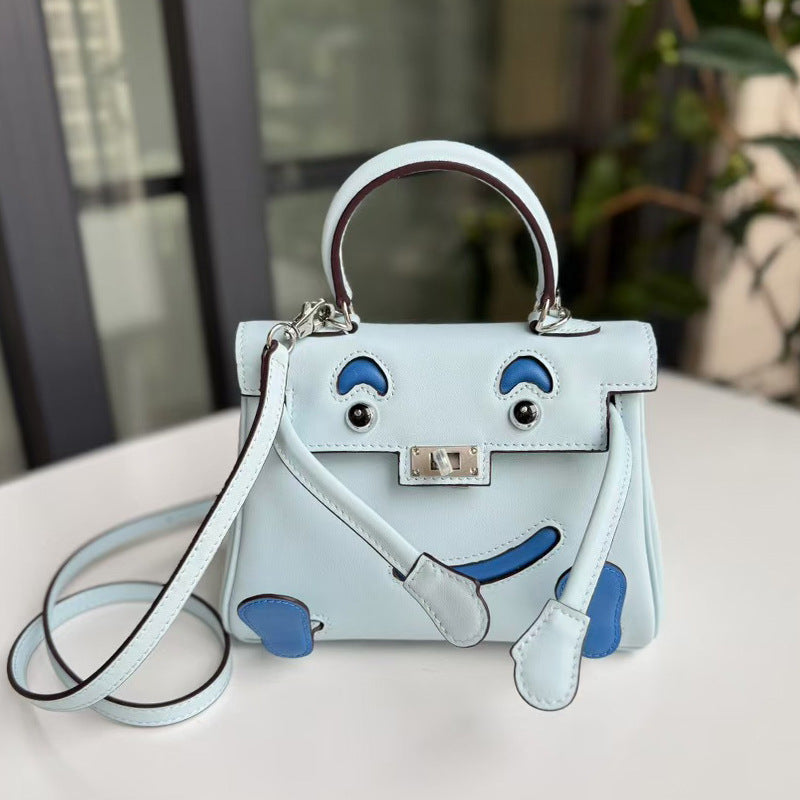 2026 new first-layer cowhide spoof smiley face small bag graffiti Kelly bag panda bag genuine leather portable messenger bag