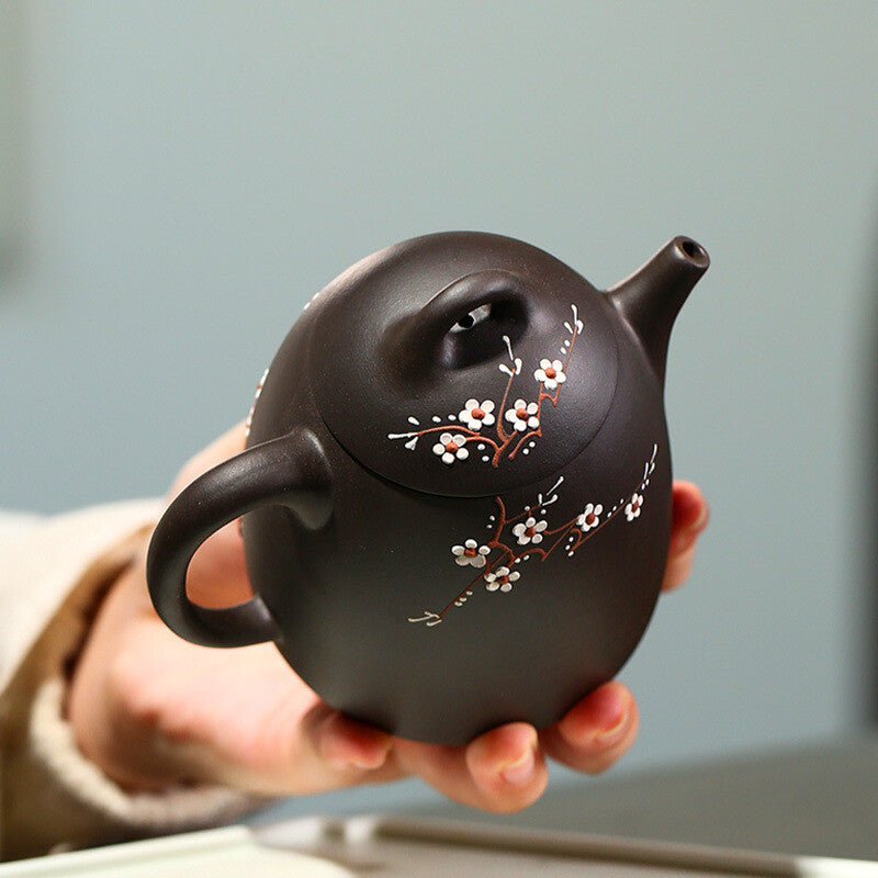Yixing teapot black mud handmade teapot Kung Fu tea set plum blossom Qin Quan