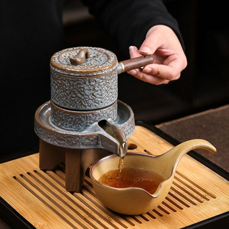 Pottery Automatic Lazy Stone Grinding Tea Set Rotating Teapot Kung Fu Tea Set